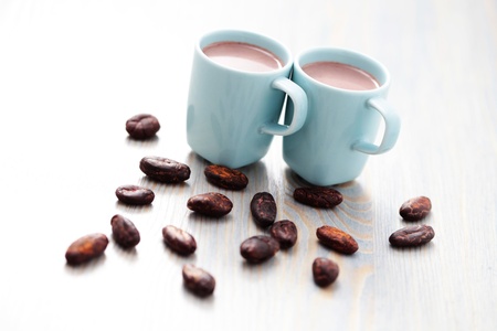 cup of hot cocoa with cocoa beans - food and drinkの写真素材