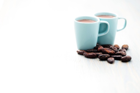 cup of hot cocoa with cocoa beans - food and drinkの写真素材