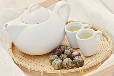 tea pot and cup of green tea - tea time