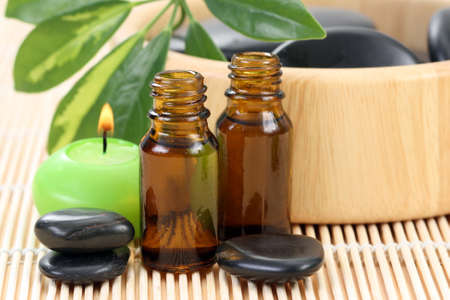 spa and wellness - massage accessories - pebbles and essential oilの写真素材