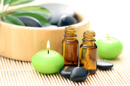 spa and wellness - massage accessories - pebbles and essential oilの写真素材