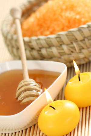 honey and honey bathsalt with candlesの写真素材