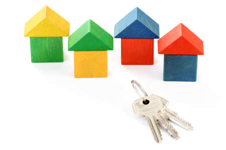 wooden houses and keys isolated on whiteの写真素材