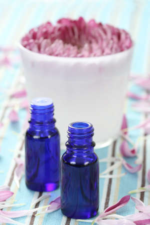 essential oil beautiful pink flower and aromatic candleの写真素材