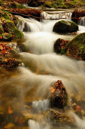 Spring flowing mountain stream waterfall in Slovakiaの写真素材