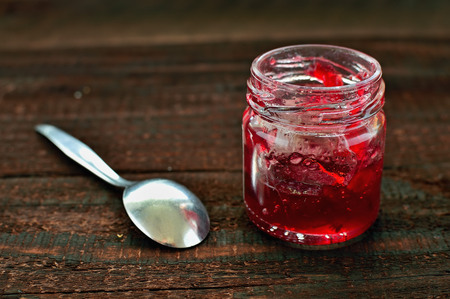Strawberry jam on wooden table. Season fruit home made marmalade. Healthy strawberries productの写真素材