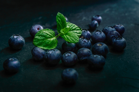 Blueberry fruit on stone background. Healthy forest fruit. Delicious fresh berries.の写真素材