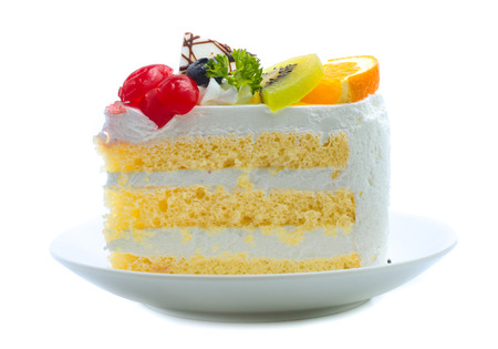 cake with cream and cherry orange blueberry isolated on white backgroundの写真素材