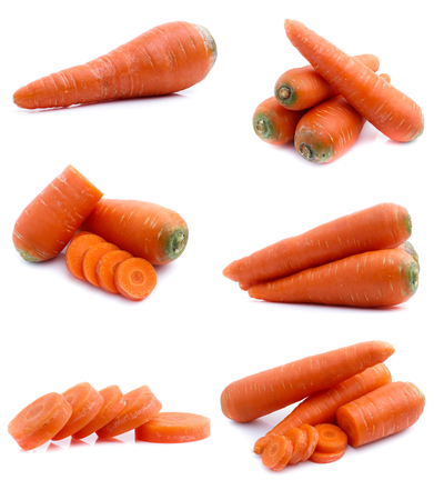 set fresh carrot fruits with green leaves isolated on white backgroundの写真素材
