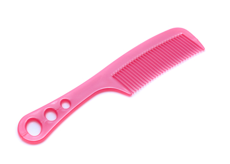 Pink comb isolated on white backgroundの写真素材