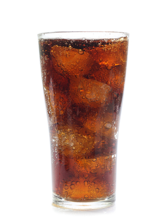 Cola in a glass isolated on whiteの写真素材
