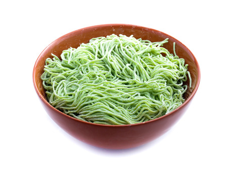 green noodle isolated on whiteの写真素材