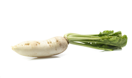 fresh white radish with slices isolated on white backgroundの写真素材
