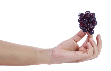 red grapes  isolated on whiteの写真素材