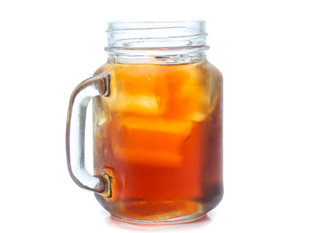 jar glass of iced tea with lemons  isolated on a white backgroundの写真素材