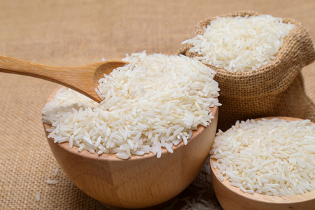 rice in bowl  on sack backgroundの写真素材