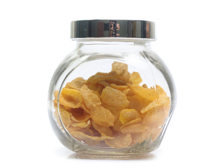 Cornflakes in bottle isolated on white background