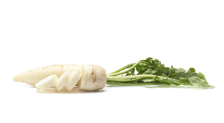 fresh white radish with slices isolated on white backgroundの写真素材
