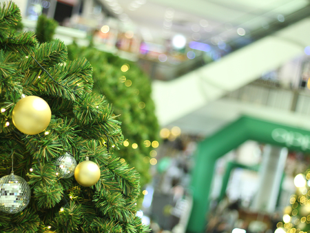bauble hanging from a decorated Christmas tree. Retro filter effectの写真素材