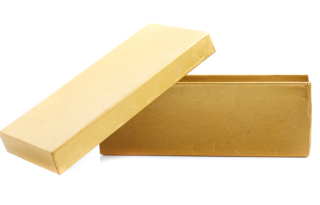 yellow gift box isolated on whiteの写真素材