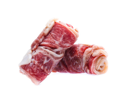 Fresh raw beef meat slices isolated over white backgroundの写真素材