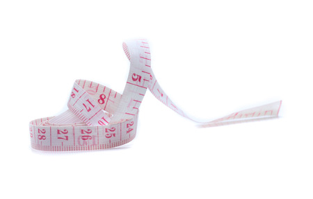 white tape measuring isolated on a white backgroundの写真素材