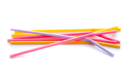 colorful plastic drinking straws isolated over the white backgroundの写真素材