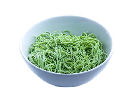 Green noodle isolated on whiteの写真素材