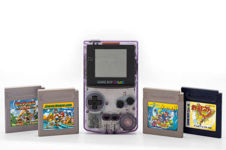 Fukuoka, Japan - june 23, 2019: the famous nintendo game boy color portable console with some famous game cartridgesのeditorial素材