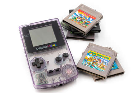 Fukuoka, Japan - june 23, 2019: the famous nintendo game boy color portable console with some famous game cartridgesのeditorial素材