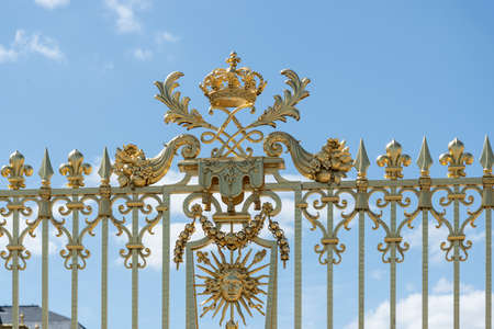 Versailles, France - August 6 2017: view of the Palace of Versailles golden gate entrance.