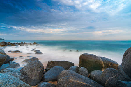 rocks on the beach on a cloudy day long exposure seascape in itoshima, kyushu, Japanの写真素材