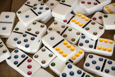Dominoes on wooden tableの写真素材