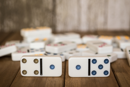 Dominoes on wooden tableの写真素材