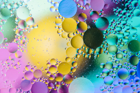 Oil drops on water surfaceの写真素材