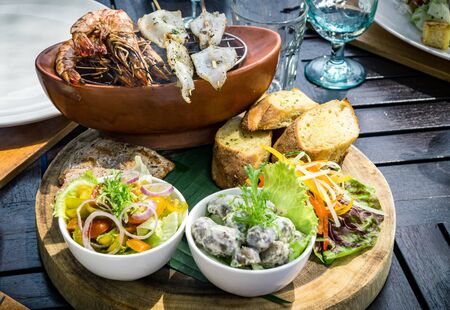 Traditional balinese sea food with salad and bread In Bali, Indonesiaの写真素材