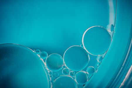 Oil drops on the water - Abstract background blue macro photography
