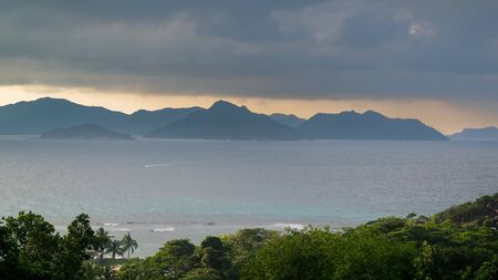 panoramic view of Seychelles, La Digue at sunset. Landscape with sky and colorful clouds. View of Praslin islandの写真素材