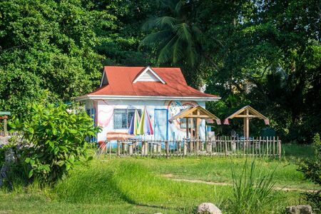 multicolored tropical house in the tropical nature of La digue island, Seychelles.の写真素材