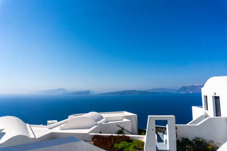 Roof top view of Santorini with the blue Mediterranean sea in the backgroundの写真素材