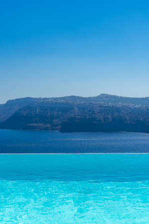 Swimming pool over Santorini caldera. Akrotiri, Santorini island, Cyclades, Greece, Europe.