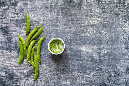 peas bunch. Healthy vegetarian food concept background, fresh green food selection for detox diet. copy space for text. view from aboveの写真素材