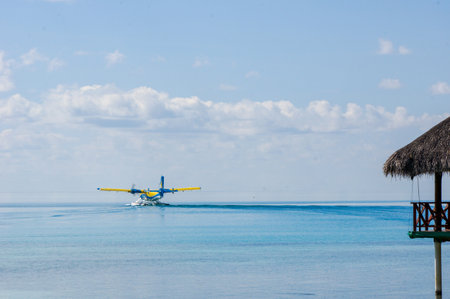 landing of a seaplane on the turquoise maldivian lagoon. luxurious travel conceptのeditorial素材