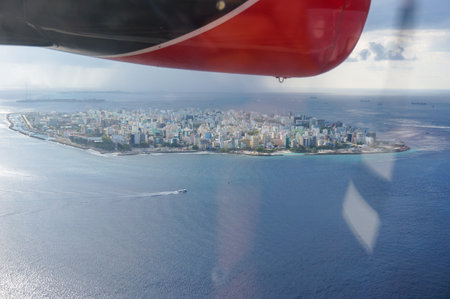 aerial view from a seaplane on male the capital city of maldives. overcrowded island in the indian...