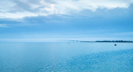 Ile de Re bridge over the sea with fog on a winter day. view from Rivedoouxの写真素材