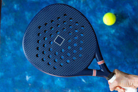 blue professional paddle tennis racket and balls on blue color background. Horizontal sport theme poster, greeting cards, headers, website and appの写真素材