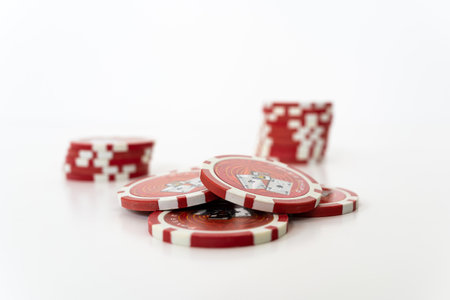 Stack of realistic red chips for casino isolated on white background. Volumetric heap of money or cash for games like poker and blackjack, roulette. Betting club and gamble, winning theme. copy space for textの写真素材
