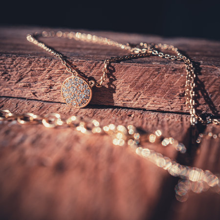 magnificent necklace on a vintage wooden bark. romantic story. Macro shot.の写真素材