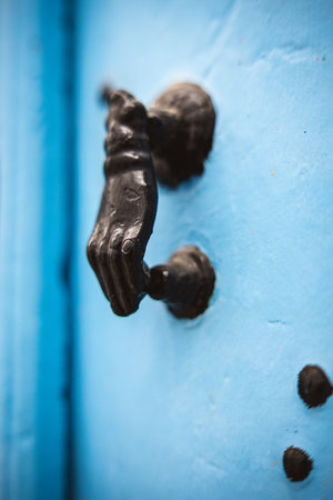 Door knocker on a blue door in the medina,Tunis, Tunisia. shallow depth of fieldの写真素材