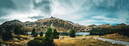 Majestic panorama of the Pyrenees with the Neouvielle peak in the background, France. panoramic...